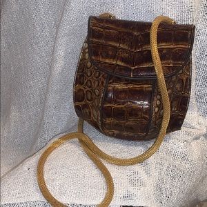 Sandra Robert’s alligator skin purse